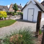 Schuppen im Reetdach-Look